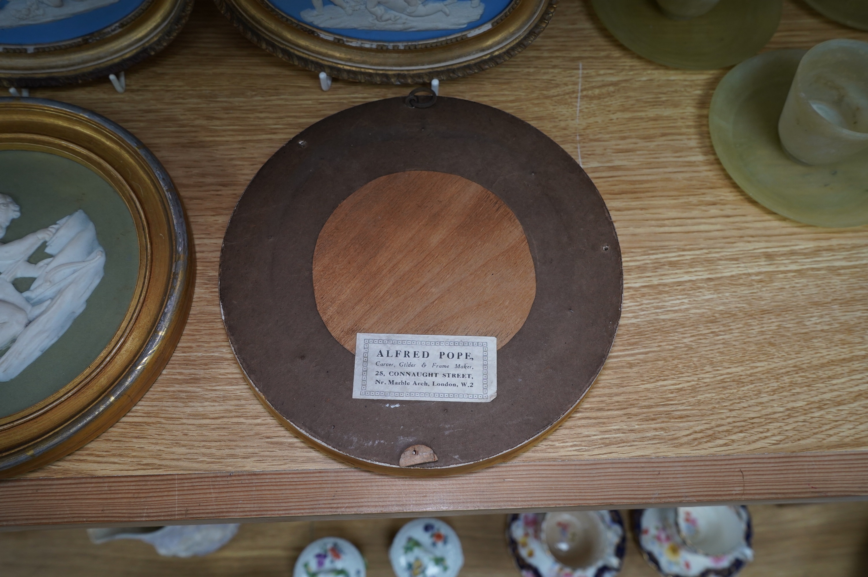 Two pairs of jasperware plaques, probably Wedgwood, in gilt frames, largest 19cm in diameter. Condition - fair to good